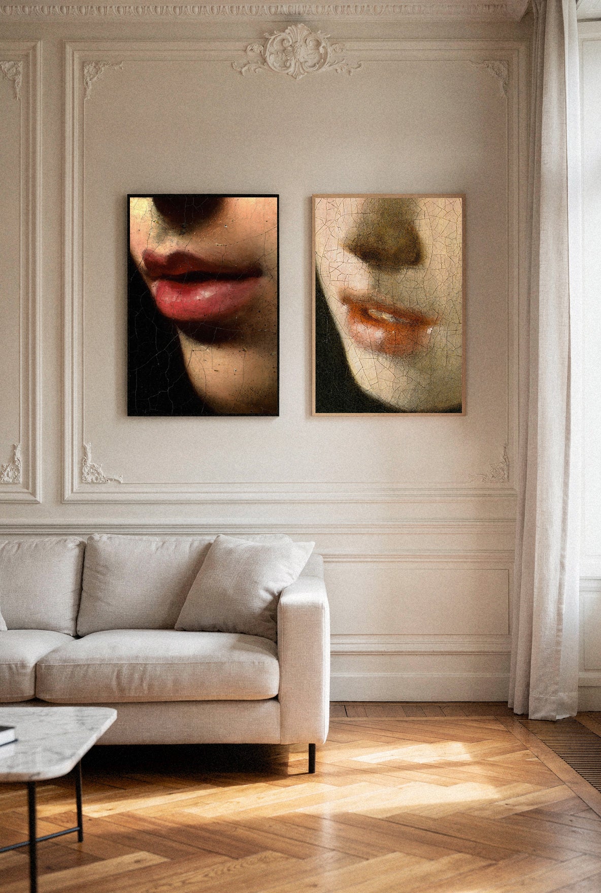 Living room with a beige sofa and wall art depicting faces.