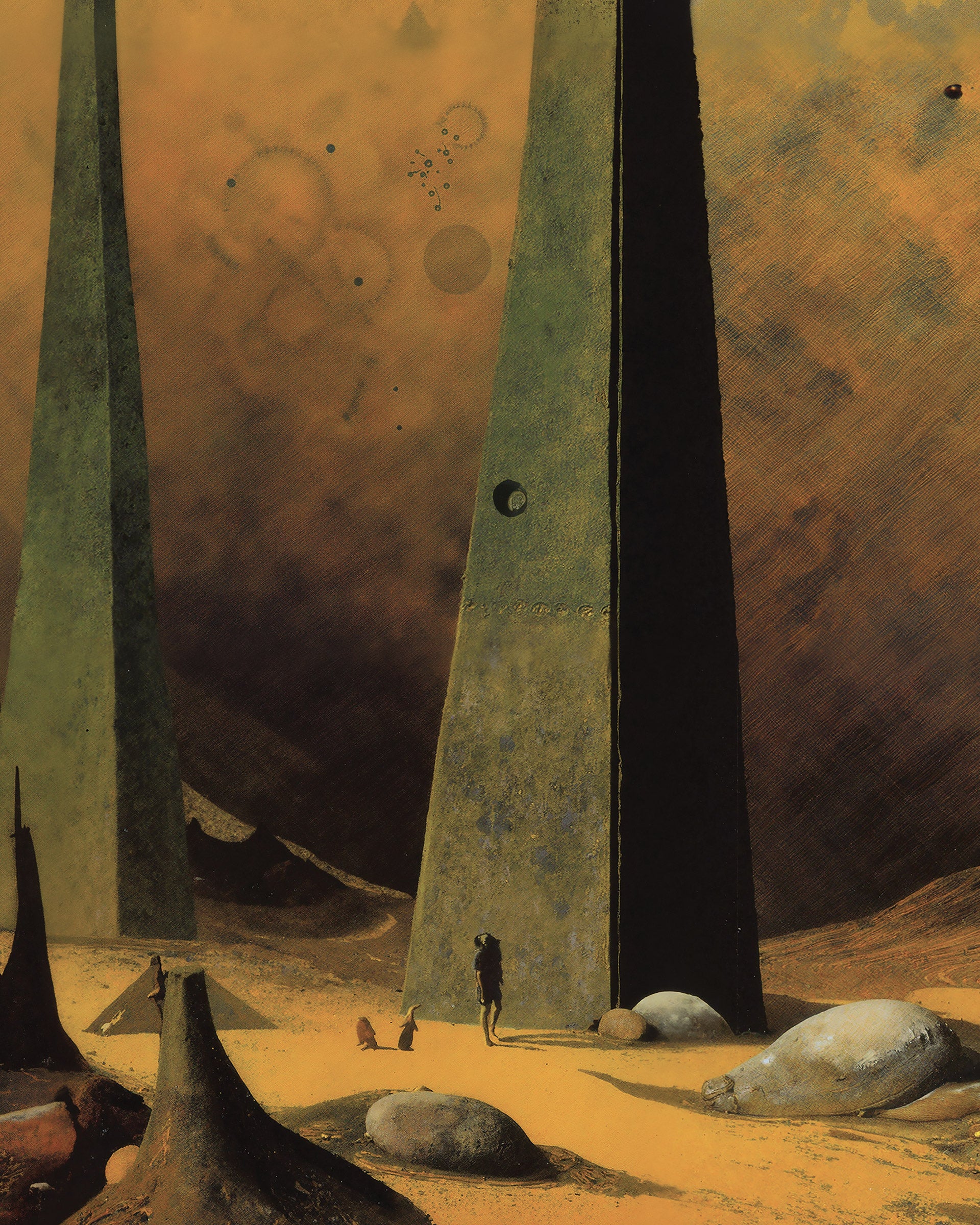A surreal desert-like artwork featuring three tall dark obelisk towers rising from a sandy ground, with small human figures standing near the center tower and several large rounded rocks in the foreground under a warm brown and orange sky.